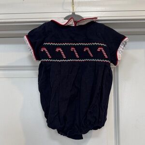 Navy Candy Cane Romper with red piping accents